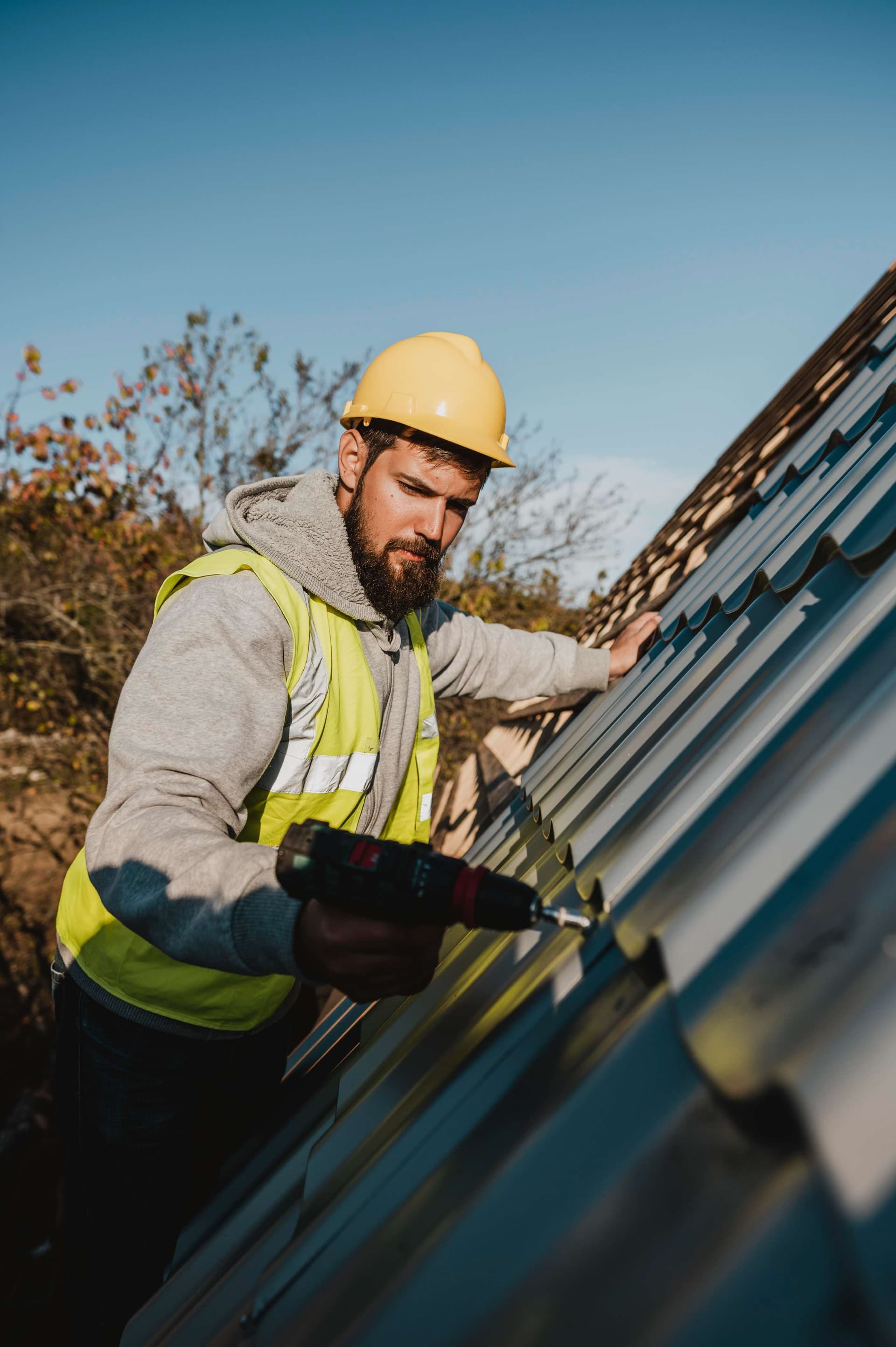 man-working-roof-with-drill,jpg